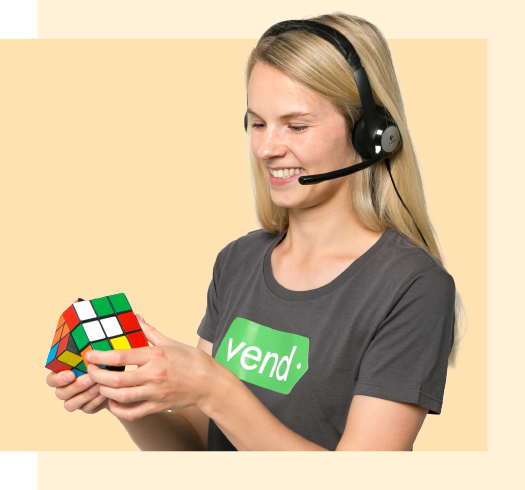 Vend support person holding a rubiks cube