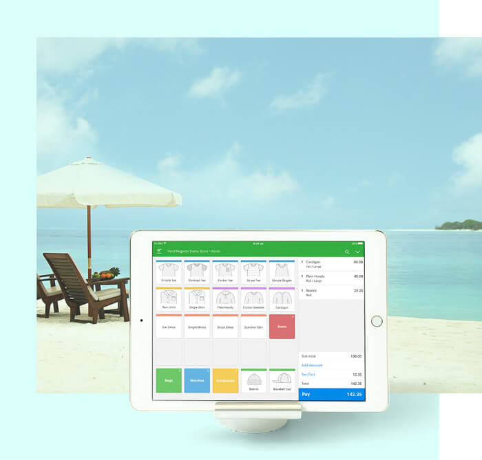 Vend on iPad infront of an image of the beach
